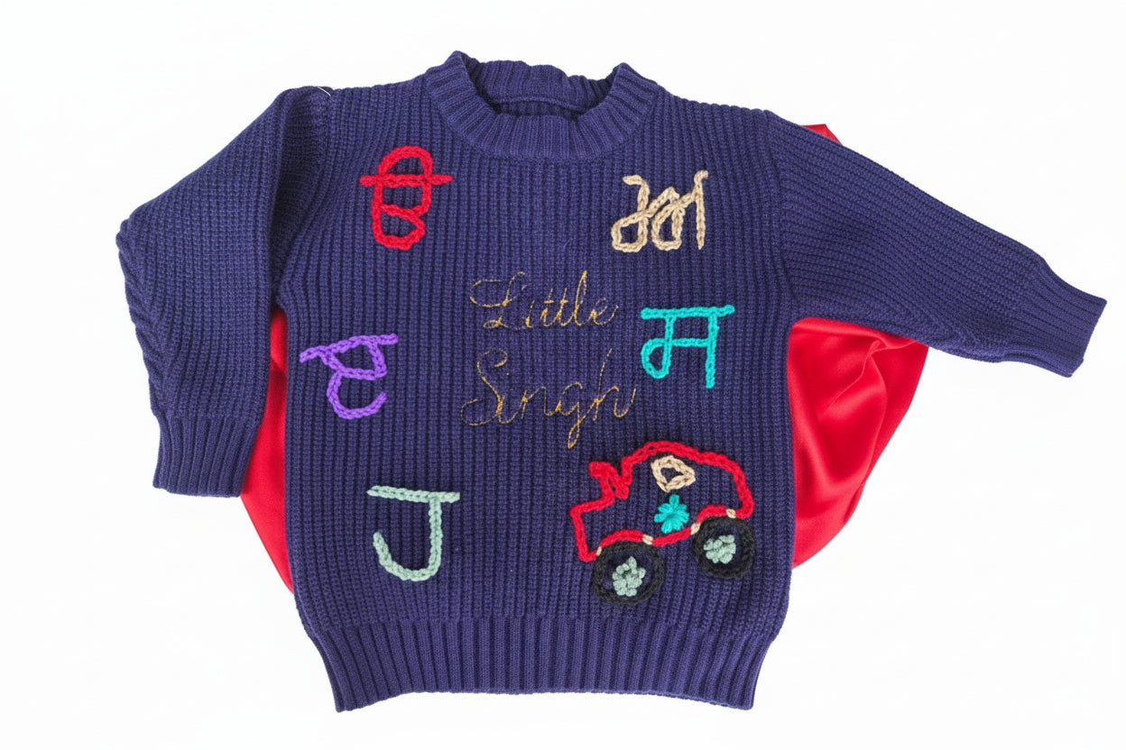 Children's sweater with colorful letters and a car design on a mannequin.